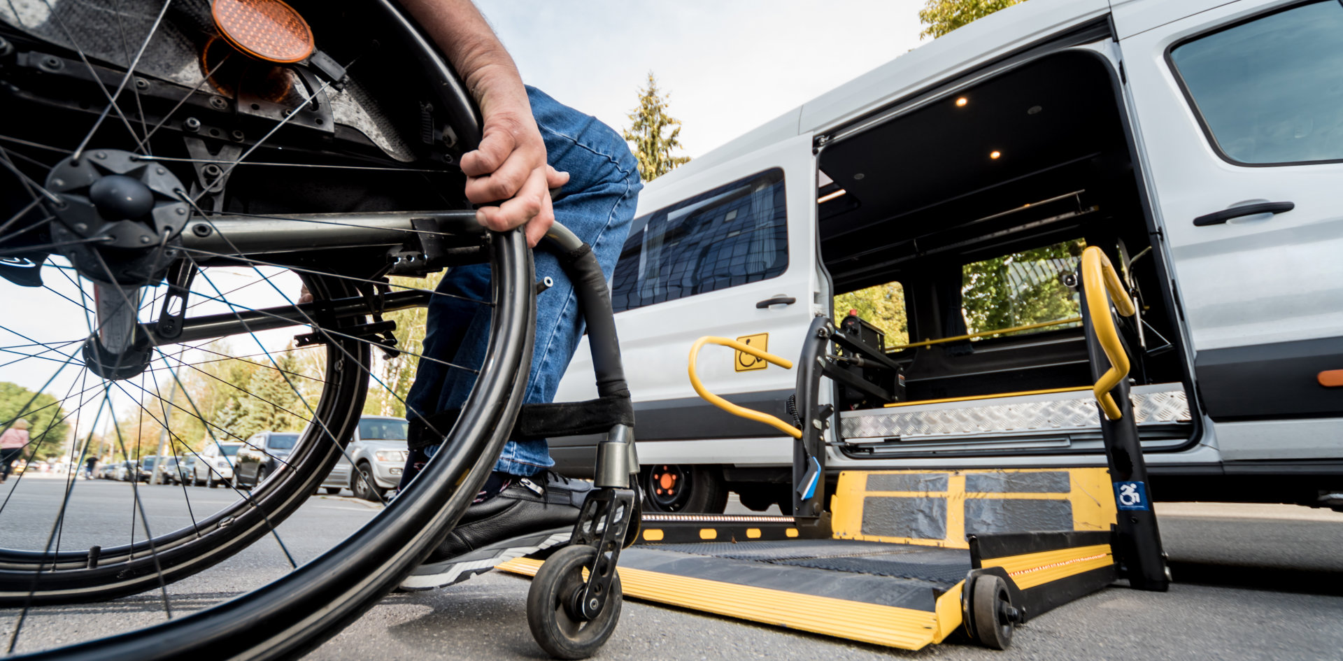 man in wheelchair getting ready to ride van