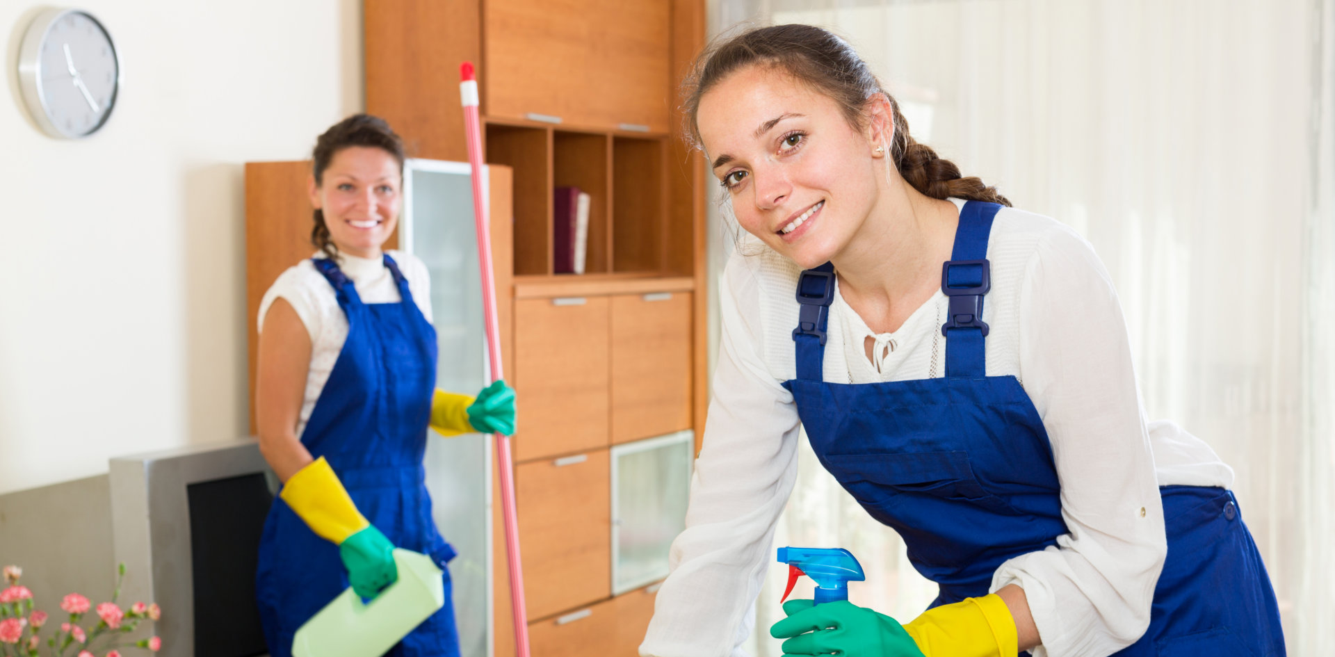 two women cleaning the house