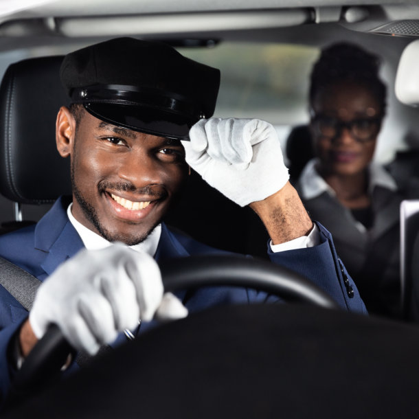 driver holding his hat