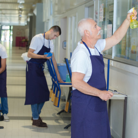 janitors cleaning the area